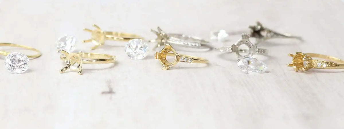 Collection of delicate engagement rings featuring stars and celestial designs in gold and silver tones.